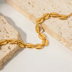 Pulseira Feminina Concha em Aço Inoxidável Banhado a Ouro 18k